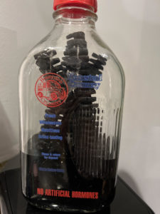 Glass milk bottle with oak spirals inside