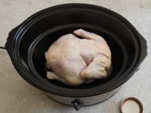 uncooked chicken in slow cooker